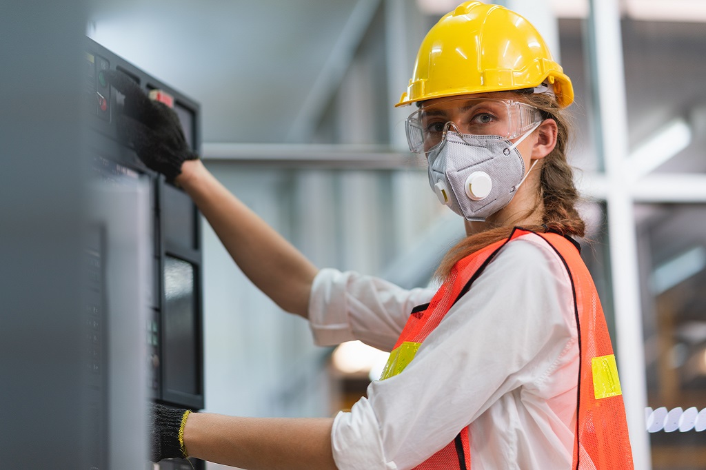 Woman with hardhat and mask Woman with hardhat and mask