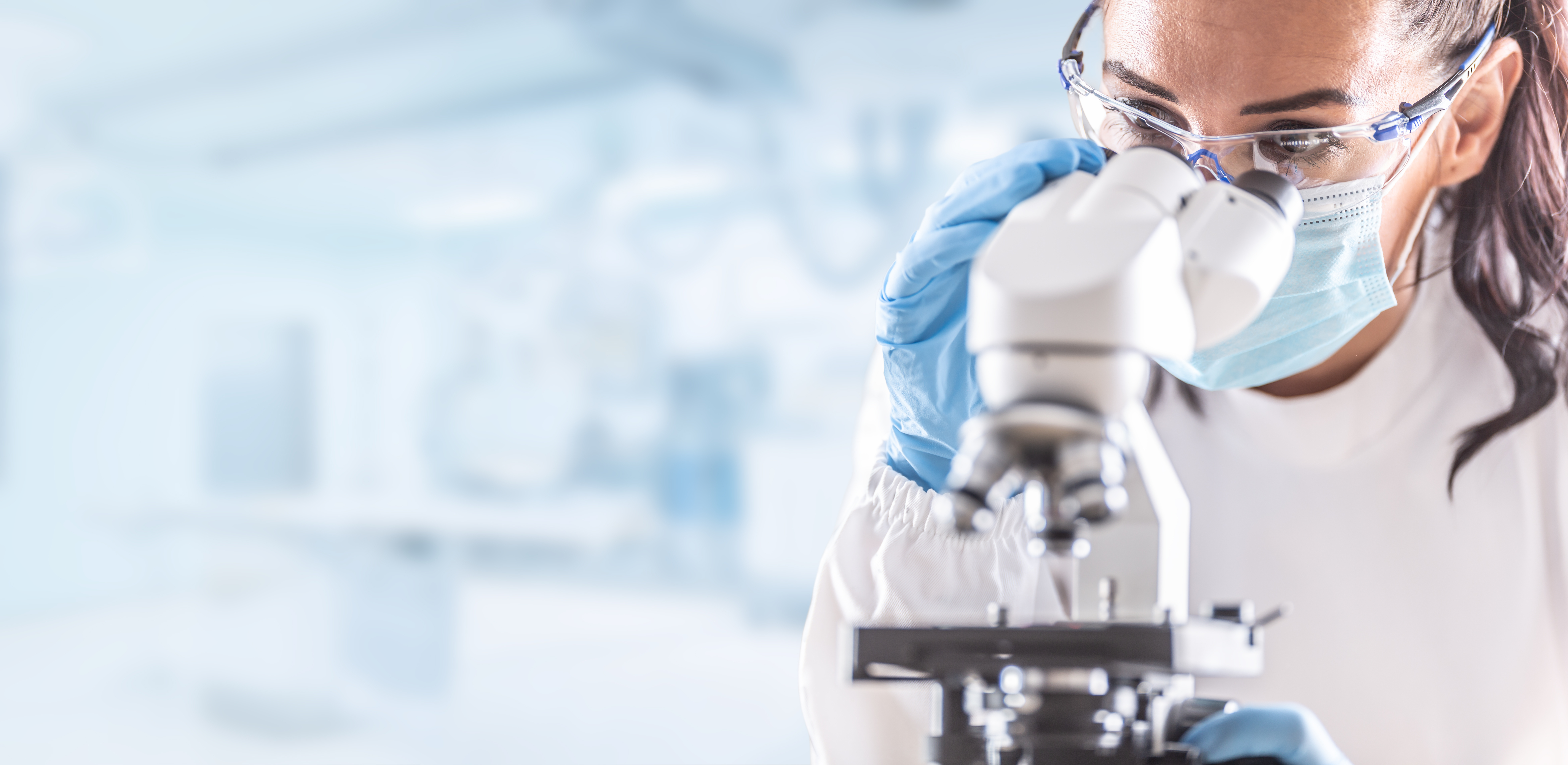 Female lab technician in protective glasses Female lab technician in protective glasses