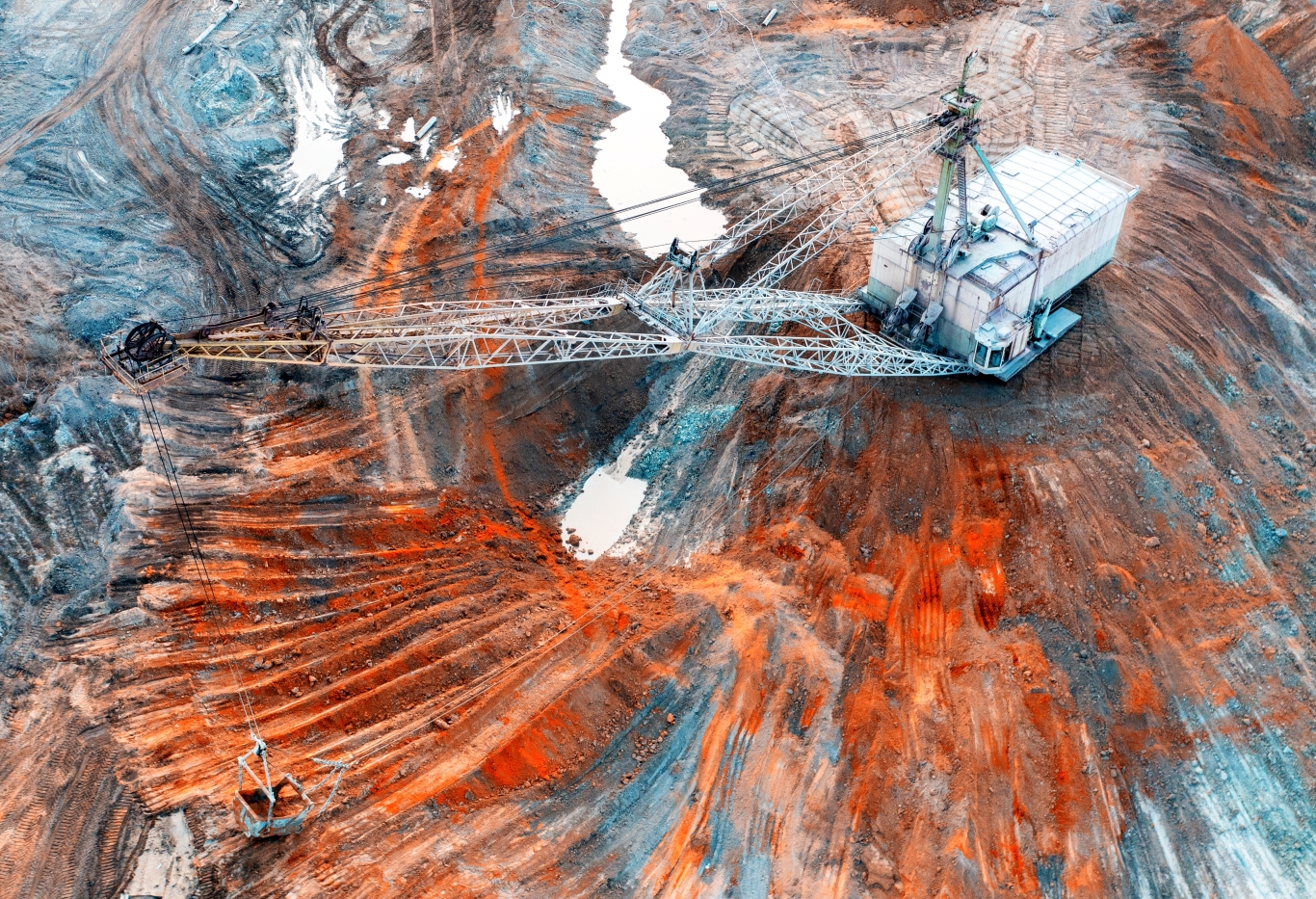 A large walking excavator works in a quarry for the extraction of rare metals A large walking excavator works in a quarry for the extraction of rare metals