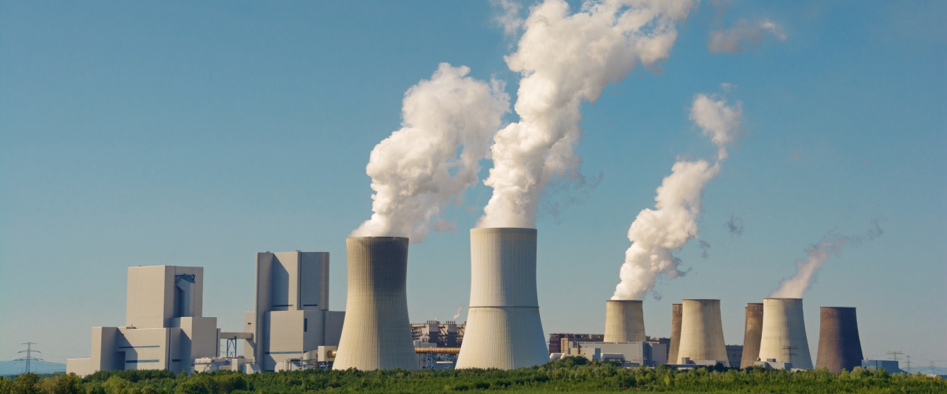 Modern coal power plant with blue sky as background Modern coal power plant with blue sky as background