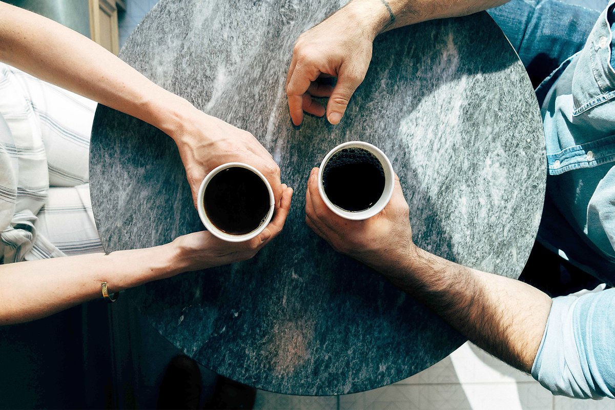 Two persons having a coffee
