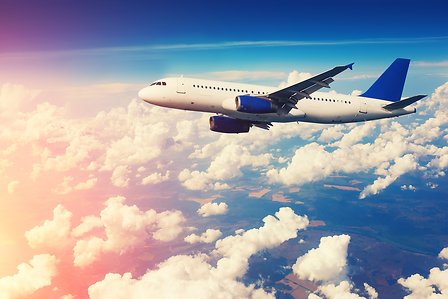 Aeroplane flying over clouds