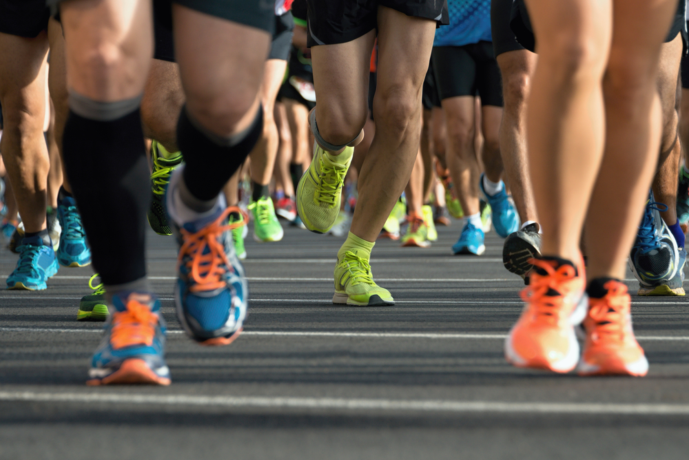 runners-feet-and-leg-on-road runners-feet-and-leg-on-road