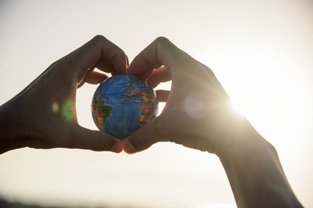 man with a world globe in his hands man with a world globe in his hands