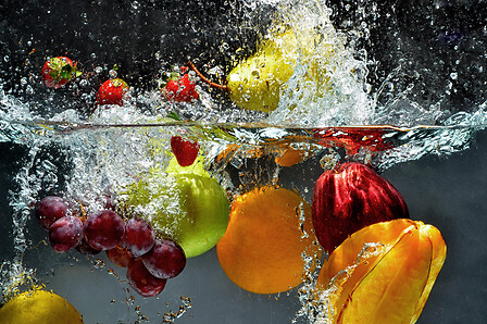 Washing fruits into water