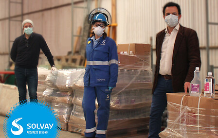 Solvay factory working with masks